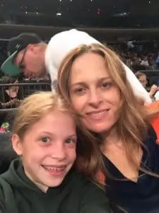 Dr. Strickland and her daughter at a playoff game for New York Liberty